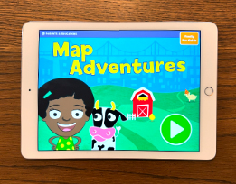 An iPad screen of the “Map Adventures” spatial thinking preschool app showing the cartoon character Gracie next to a cow.