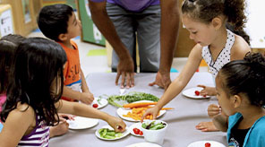 Students eating vegetables.